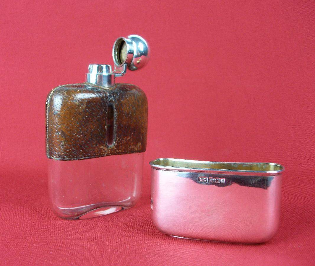 silver and leather bound hip flask